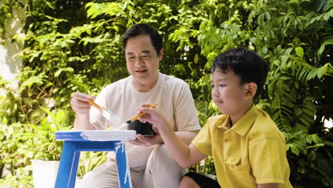 asian man and boy in the backyard