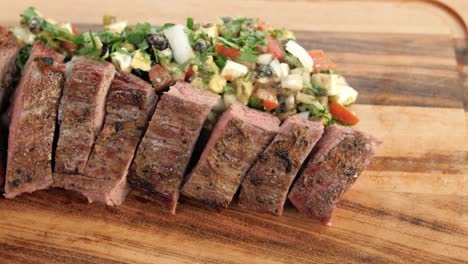 juicy medium rare flank beef with vegetables, slow motion