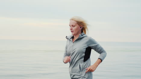 Woman-Jogging-Along-a-Shore-Early-Morning