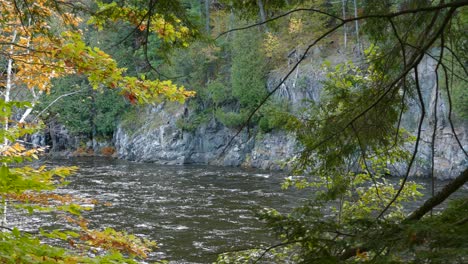 Peeking-outside-the-fall-forests-reveals-a-beautiful-dramatic-river-cliff-bluff