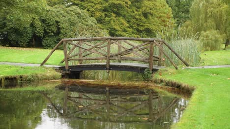 old bridge with flying birds behind