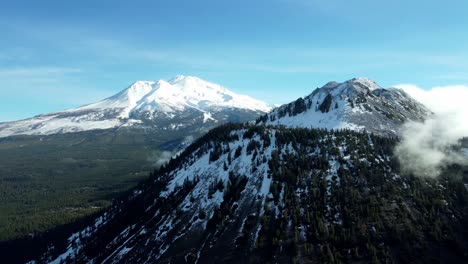 usa, ca, weed, , 2024-12-27 - drone view of mt shasta in winter with black butte in the foreground