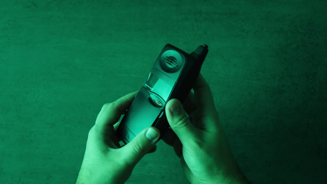 Vintage Flip Phone in Hands