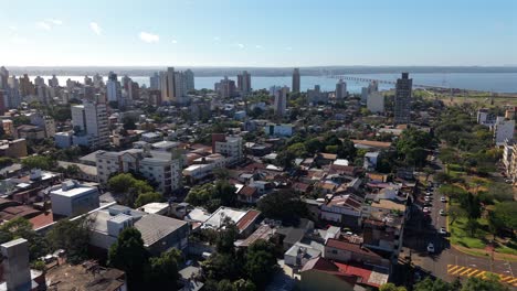 dense residential area in posadas with mid-rise buildings and tree lined streets environment, misiones, argentina