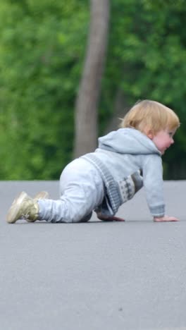 little boy playing on the road