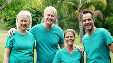 Happy-family-standing-in-park