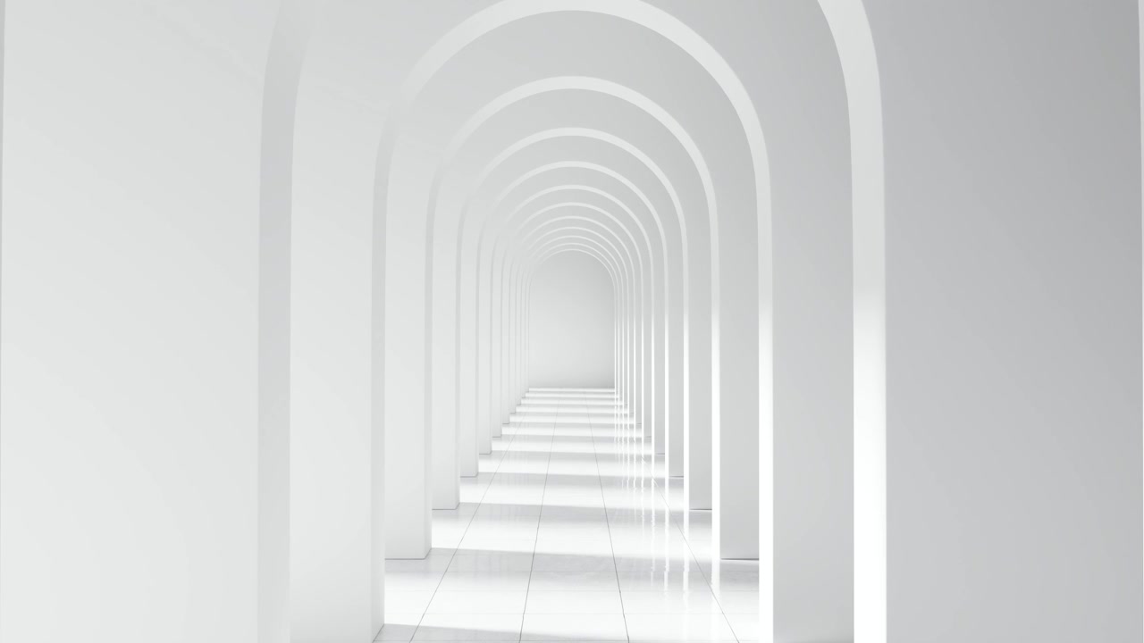 Attraversando un corridoio ad arco bianco e minimalista.