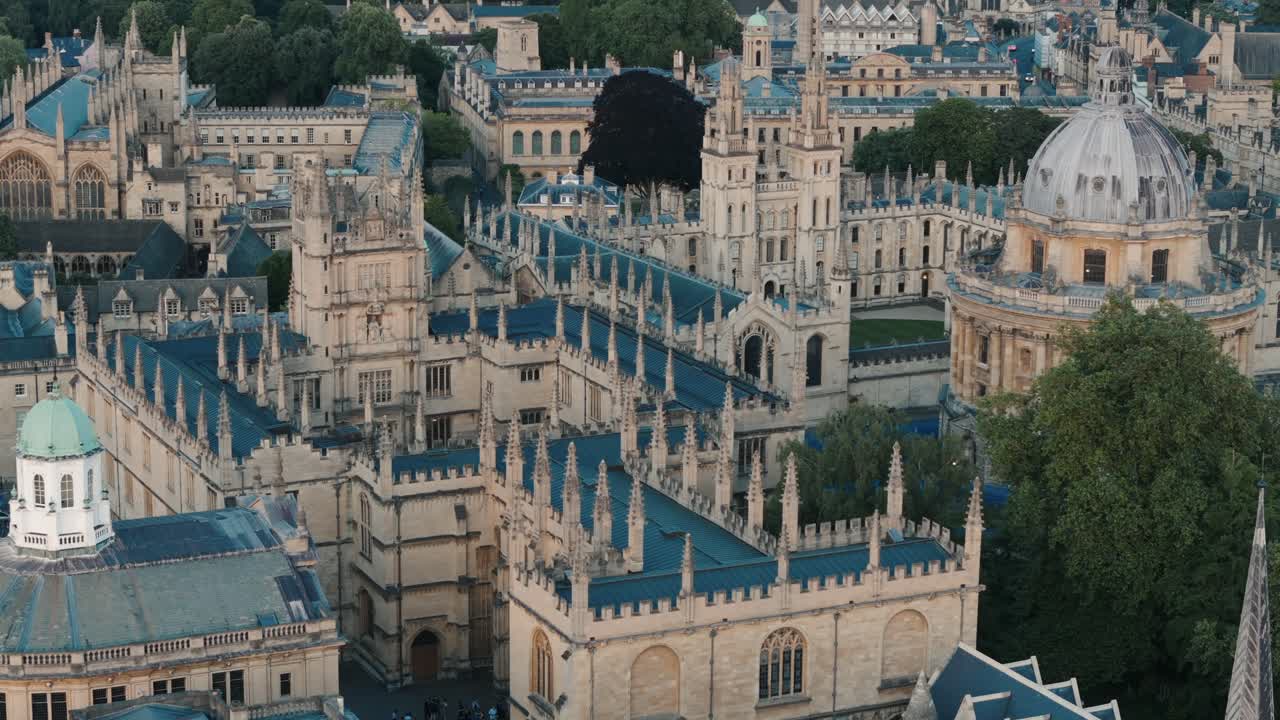 Zoomed in establishing aerial shot of Oxford rooftops and Bodleian Library