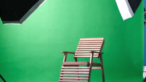 photo or video studio with two hexagone studio lights. green screen and fixed chair