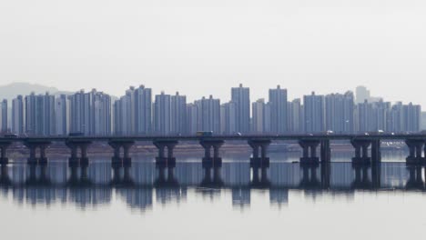 jamsil bridge with apartments buildings looming in the background in seoul, south korea