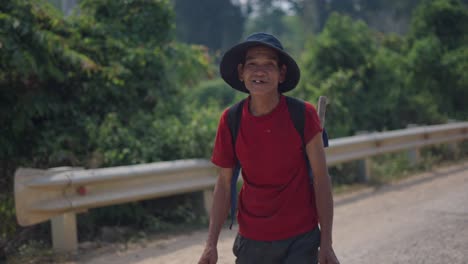 elderly man hiking in rural area