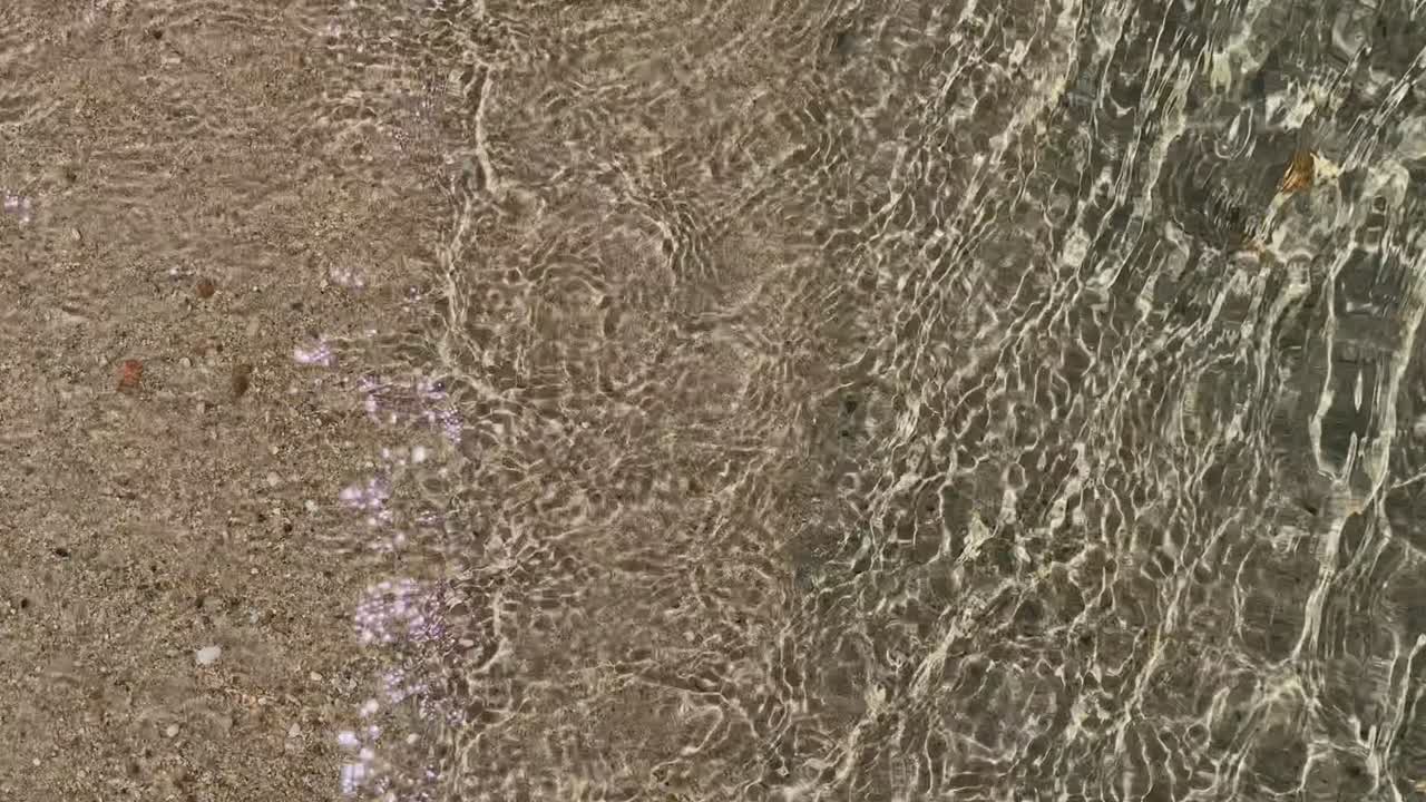 Stunning beach scene in Halkidiki, Greece, with elegant sunbeds facing the crystal-clear turquoise sea. A perfect summer escape in the heart of the Aegean.