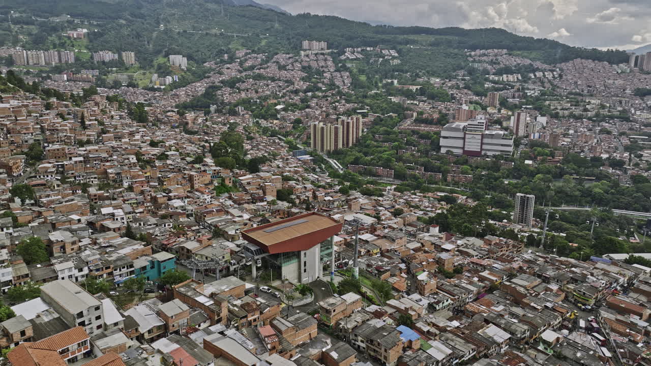 Medellin Colombia Aerial v42 drone flyover and around El Pinal Gondola lift station capturing Communa 8 and Villa Hermosa residential hillside neighborhoods - Shot with Mavic 3 Cine - November 2022