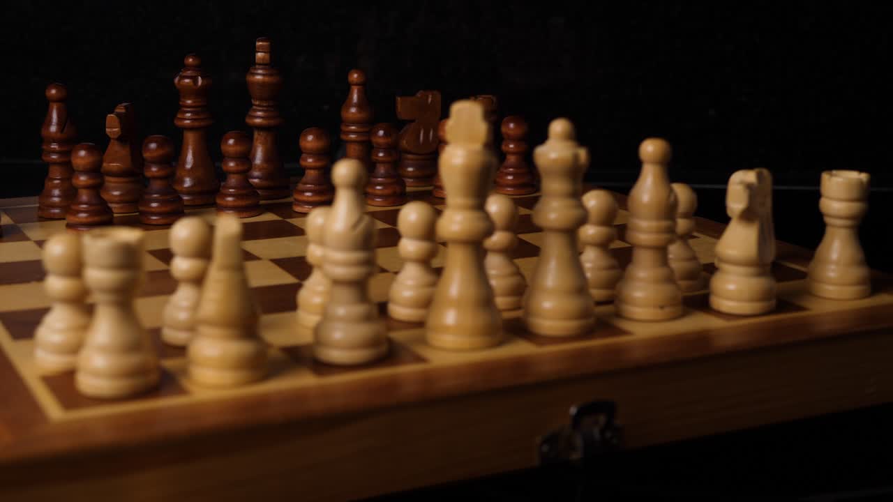 Macro shot behind chess figures on a chess board