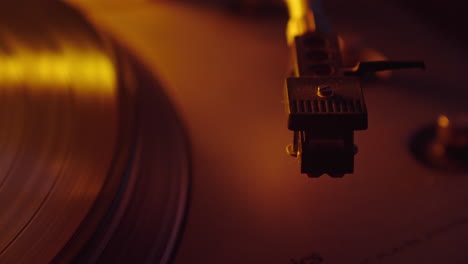 close-up shot of a vinyl record and a turntable needle