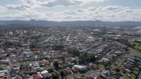 aerial panoramic establishing dolly above homes in port kembla nsw australia