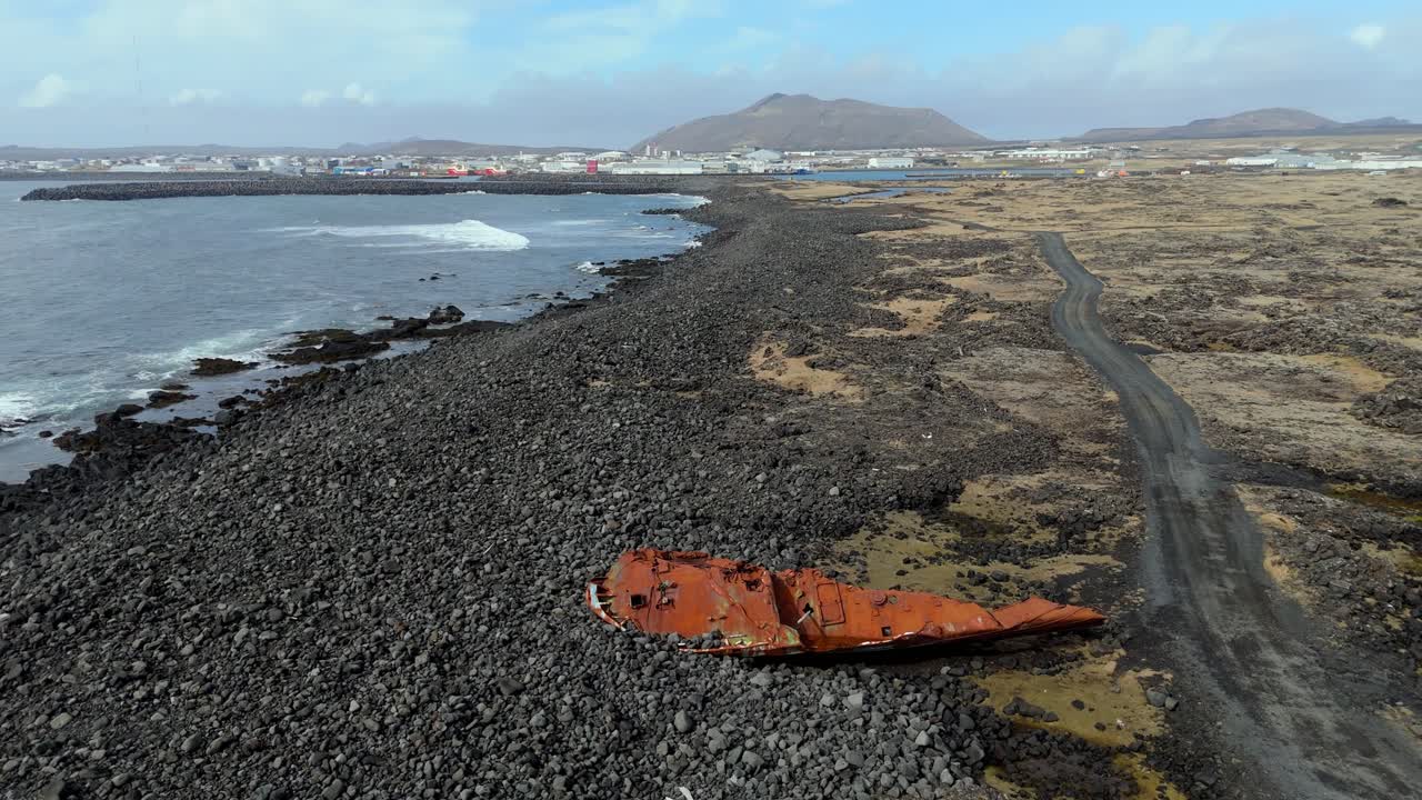 aerial view of Iceland, Fisherman Ship Wreck in black sand beach of Grindavik abandoned boat