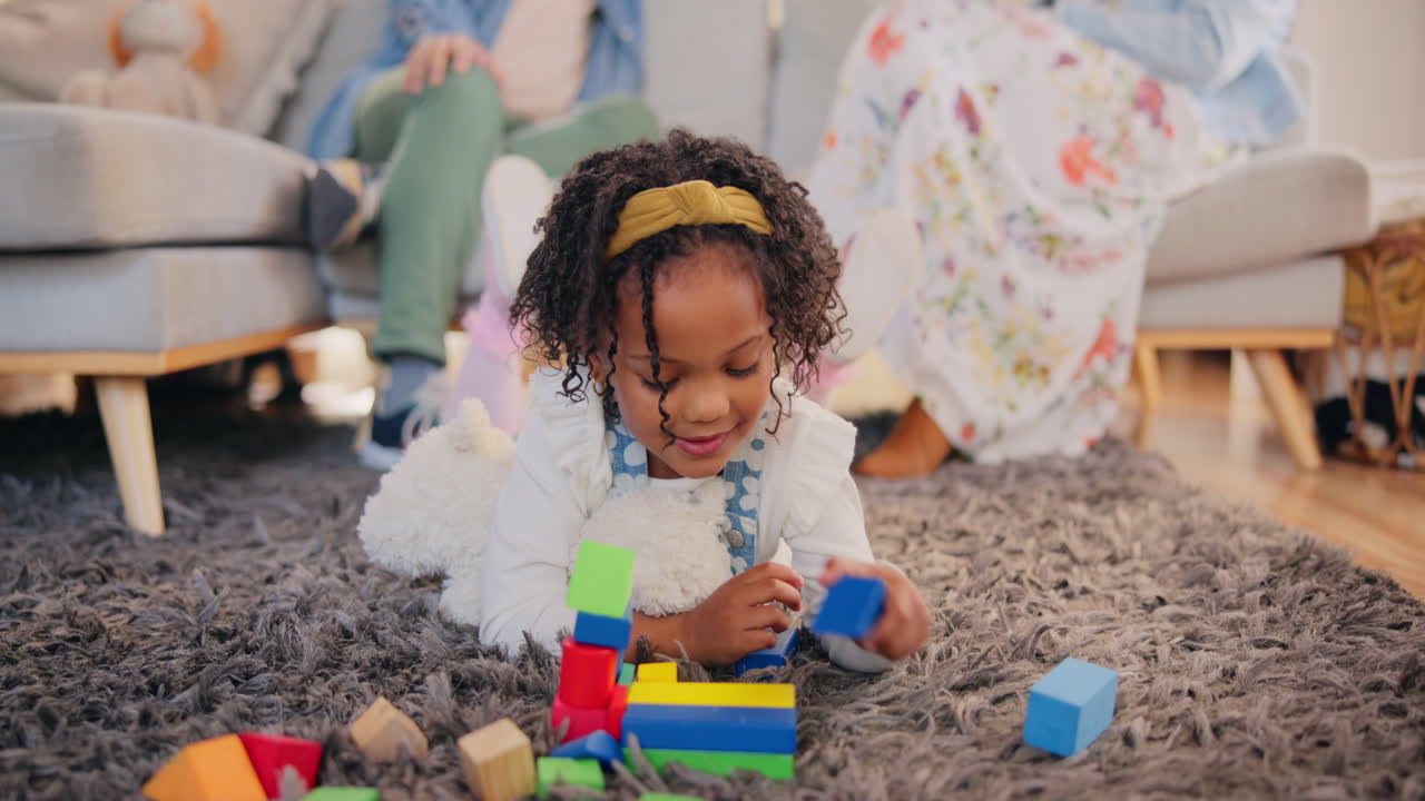 Little Girl Playing with Blocks at Home