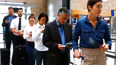 Commuters-standing-in-queue-for-check-in