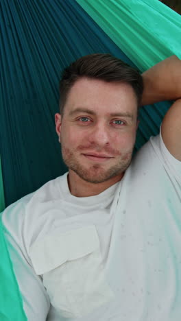 man relaxing in a hammock