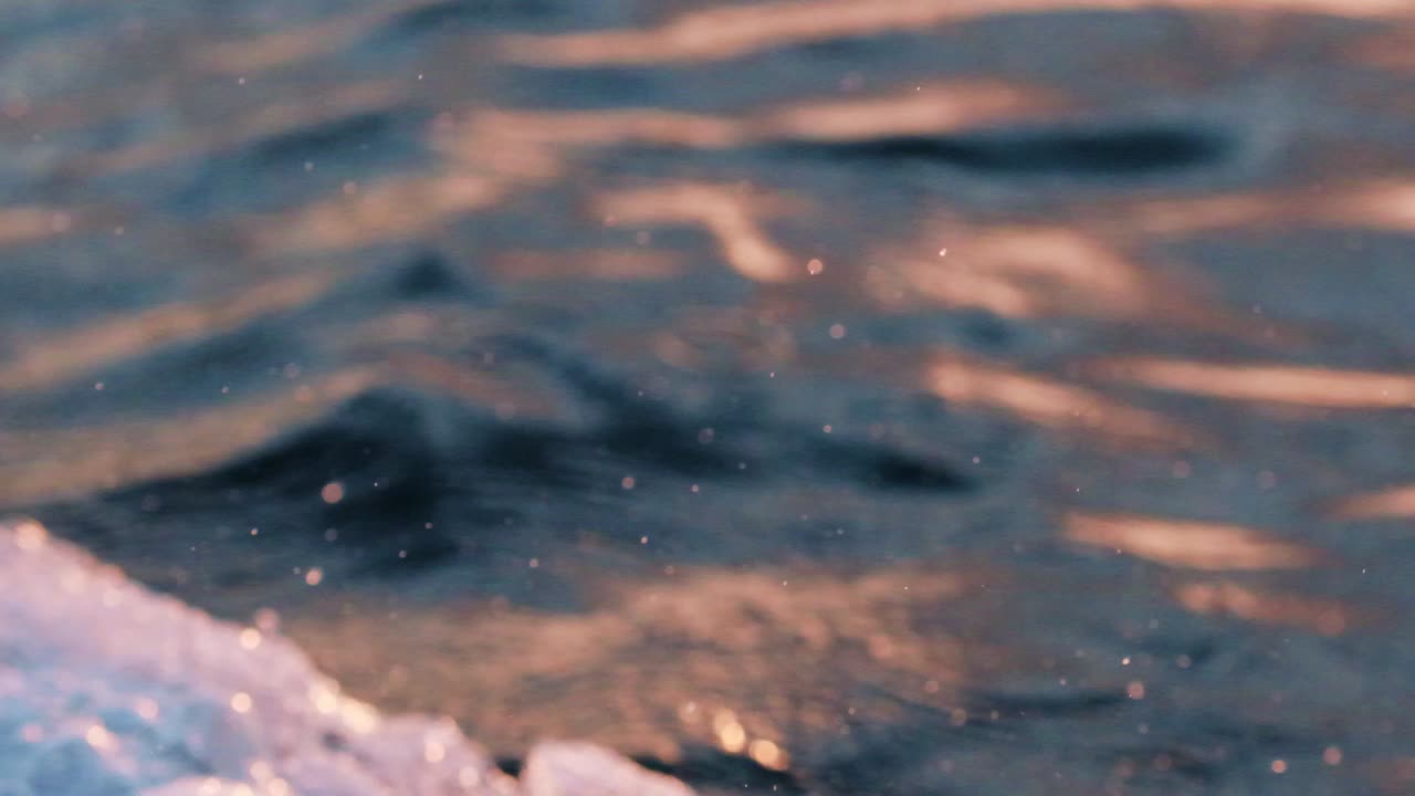 White splashes by the boat, traveling over water -Close up Slowmo