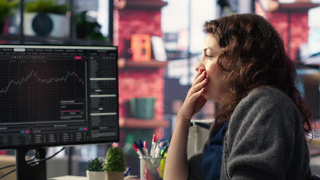 frustrated entrepreneur tracking stock market growth on dual monitors