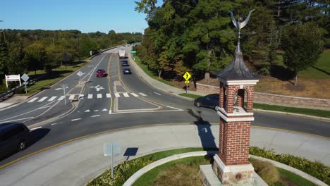 aerial shot of roundabout with statue in middle