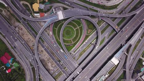 4k drone footage top view of highway road junctions. the intersecting freeway road overpass the eastern outer ring road of bangkok, thailand.