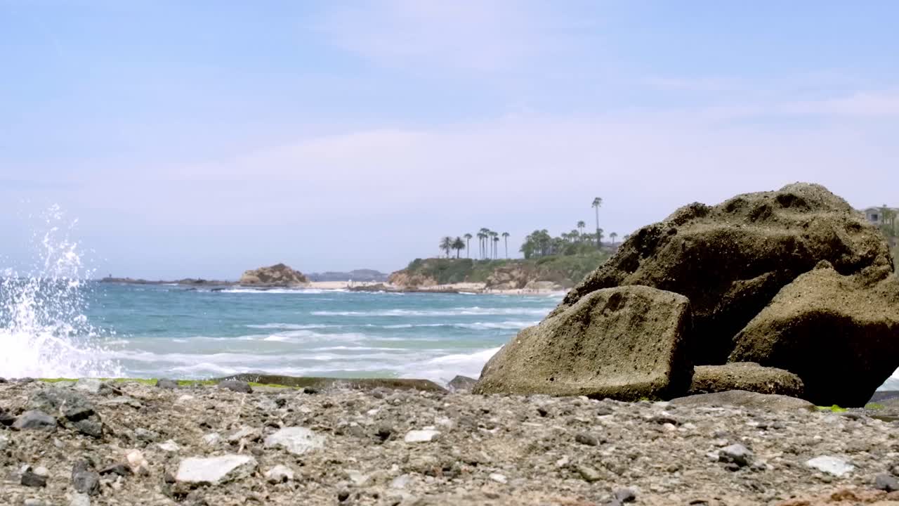 Serene Beach Scene with Rocks and Ocean Waves