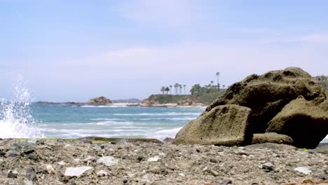 serene beach scene with rocks and ocean waves