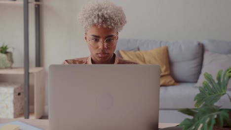 young african american woman entrepreneur uses laptop to working internet