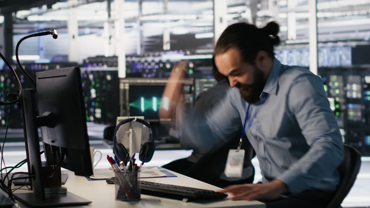 Vertical video Angry data center engineer banging fist on desk after seeing system failure