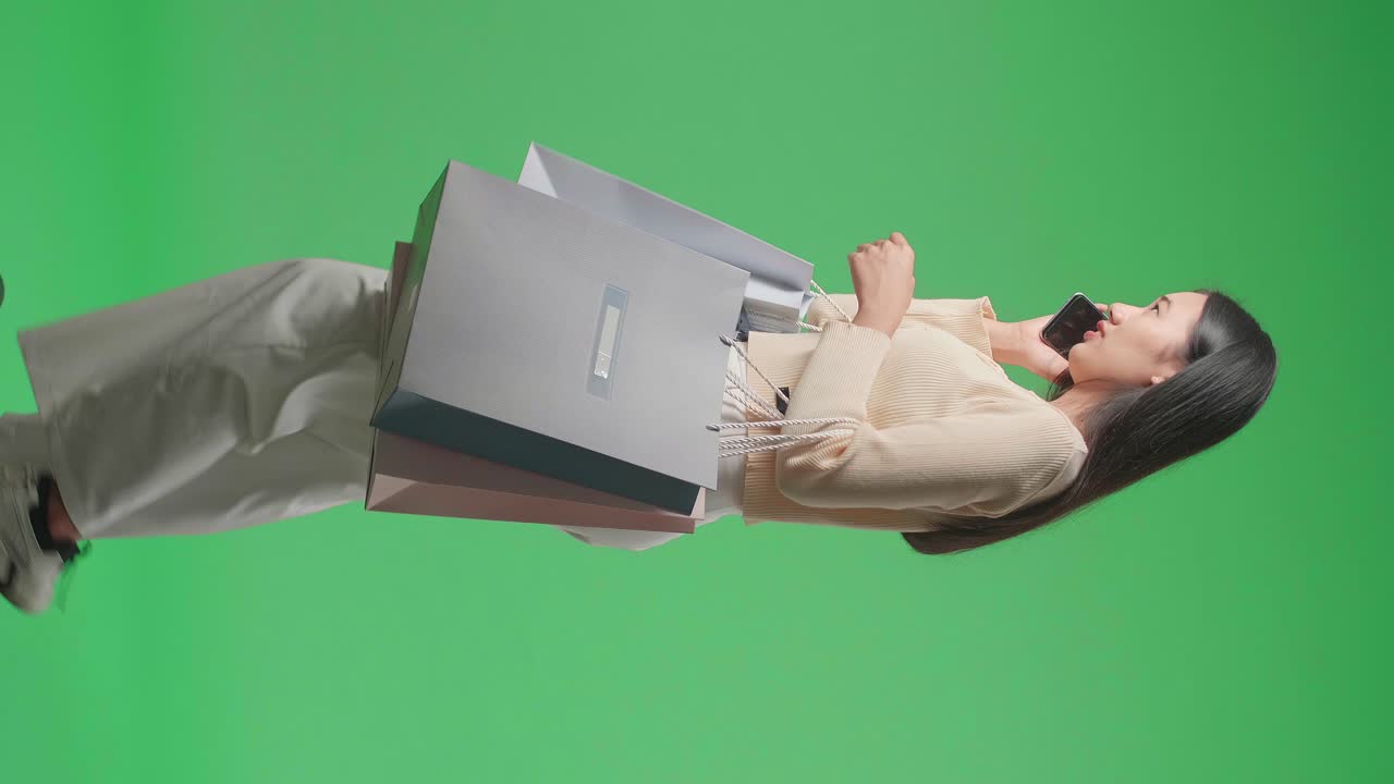 Woman Shopping and Talking on Phone