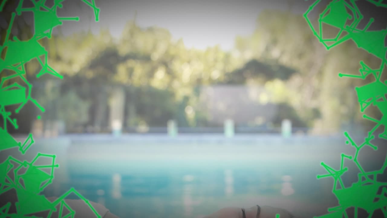 Green digital particles drifting over pool revealing model reclining smiling under wellness overlay