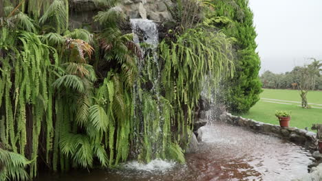 Slow-motion-shot-of-a-waterfall-feature-in-a-garden-in-Pachacamac,-Lima,-Peru