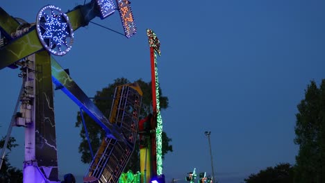 amusement ride spinning at night with lights