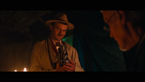 a photographer and an antique dealer in the gypsy circus cart