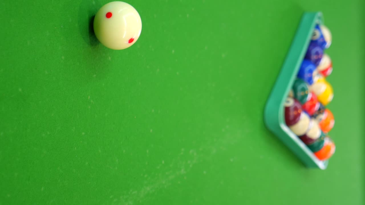 Pool balls on a green billiards table