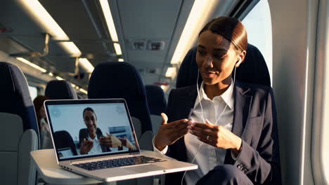 professional woman on train conducting video conference