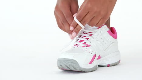 Athletic-runner-tying-up-her-shoe-laces