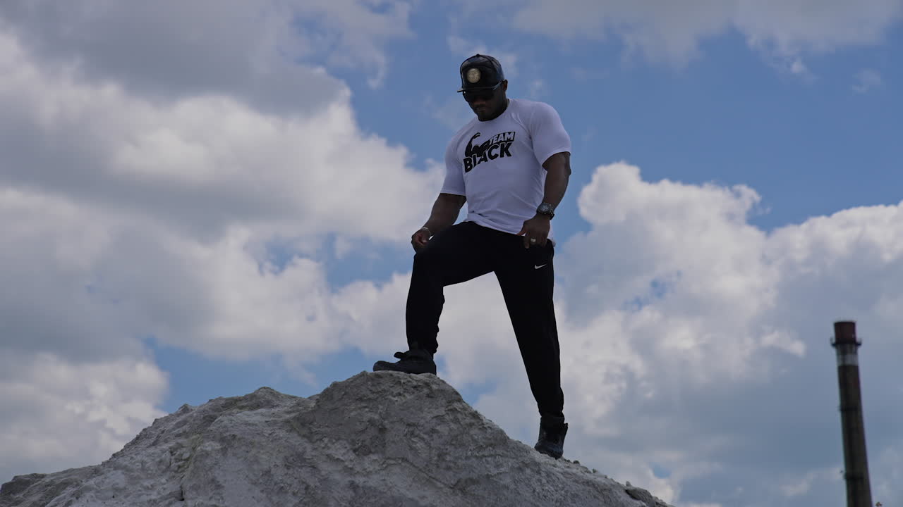 Confident sexy fashion male outdoor. Sexy athletic man with perfect body posing on nature