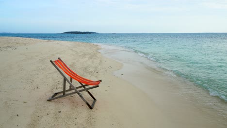 wooden comfortable chair on the beach clear sky and beautiful sea.