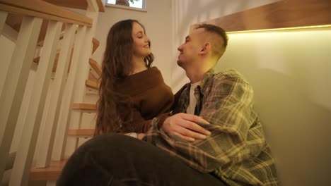 a loving couple is spending time at home.
