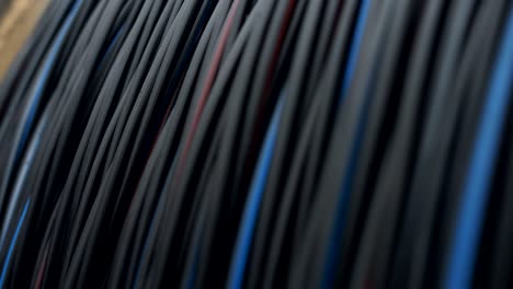 close-up of a power cable on a big wooden spool. finished products cable plant.