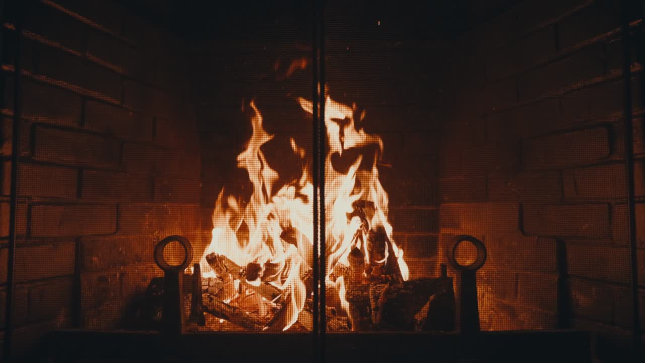 Warm Glow From Firewood Burning In Fireplace. static shot, slow motion