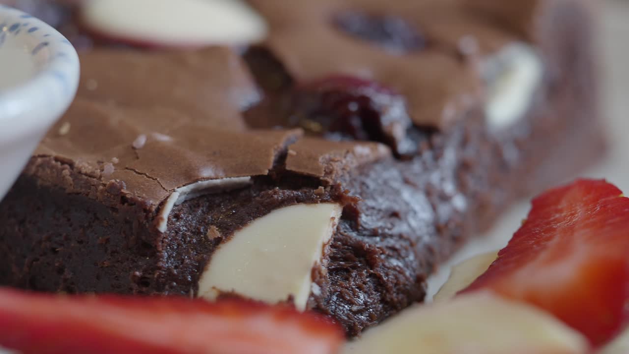 Close-up of a delicious brownie with strawberries
