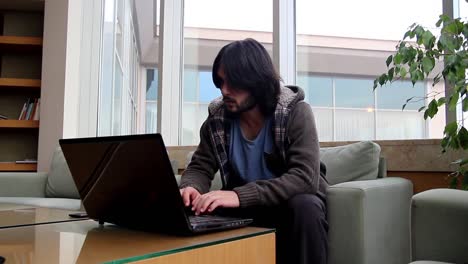 Man-Hands-Working-A-Laptop-Keyboard-And-Mouse