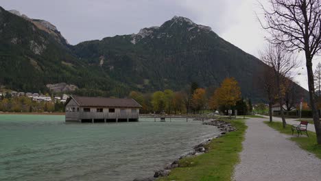 boat house on achensee on a windy autumn day in the mountains of the alps