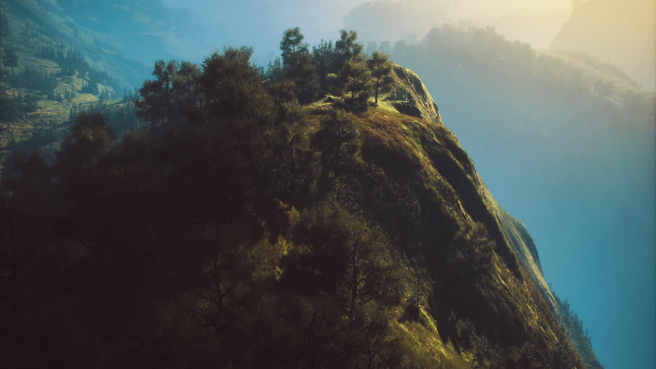 Majestic mountain peak bathed in warm morning sunlight in a tranquil valley