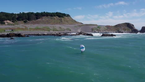 a drone view of the mountains reaching the ocean in matanzas, chile. with strong winds and large waves it is a surfer or windsurfers paradise